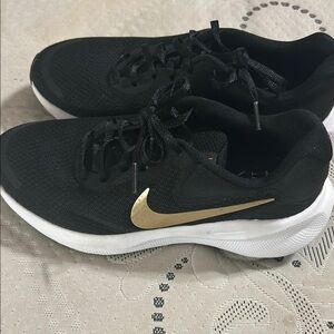 Nike Black and Gold Sleek Sneakers